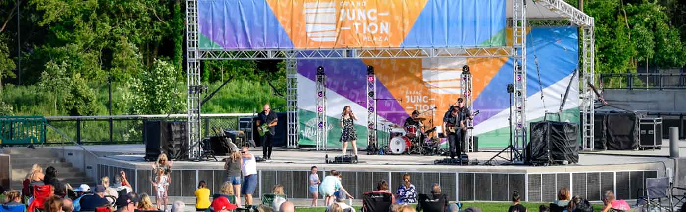 band performing on an outdoor stage in westfield, in