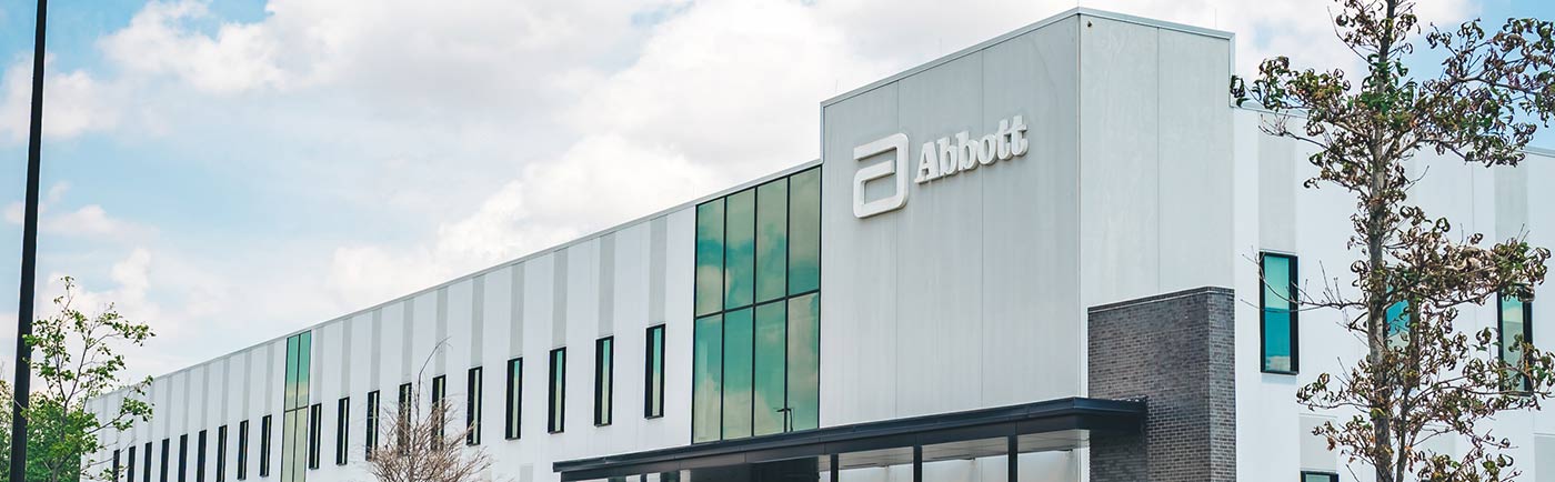 A modern building facade of the Abbott facility.