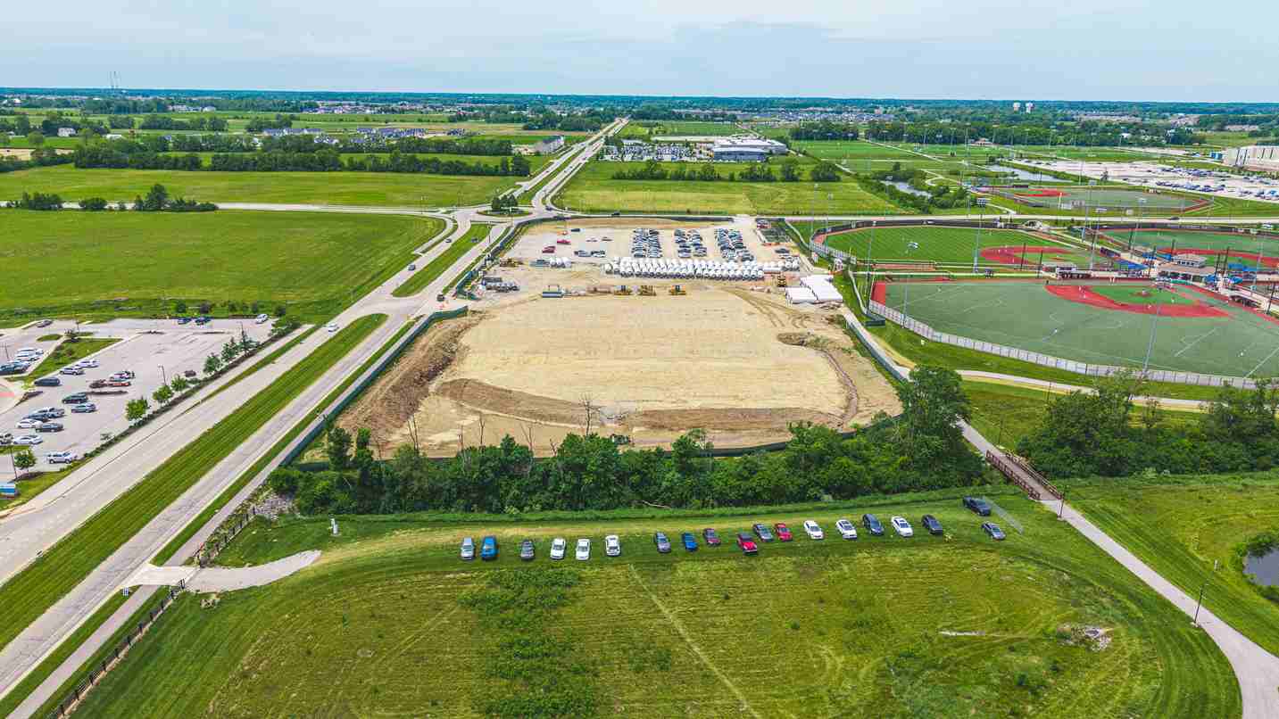 Aerial view of development site along roadway near sports complex